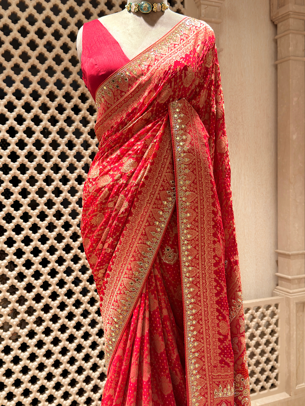 Radiant Red Khaddi Georgette Saree adorned with Mirror Work & Bandhani Weave - Unstitched Blouse