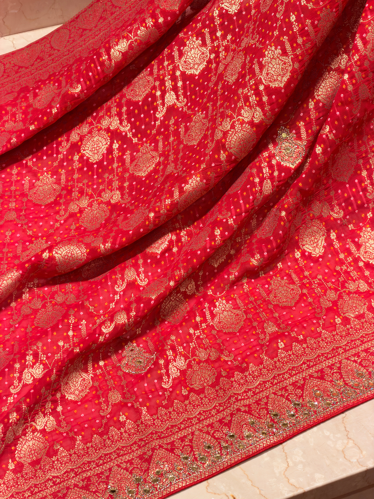 Radiant Red Khaddi Georgette Saree adorned with Mirror Work & Bandhani Weave - Unstitched Blouse