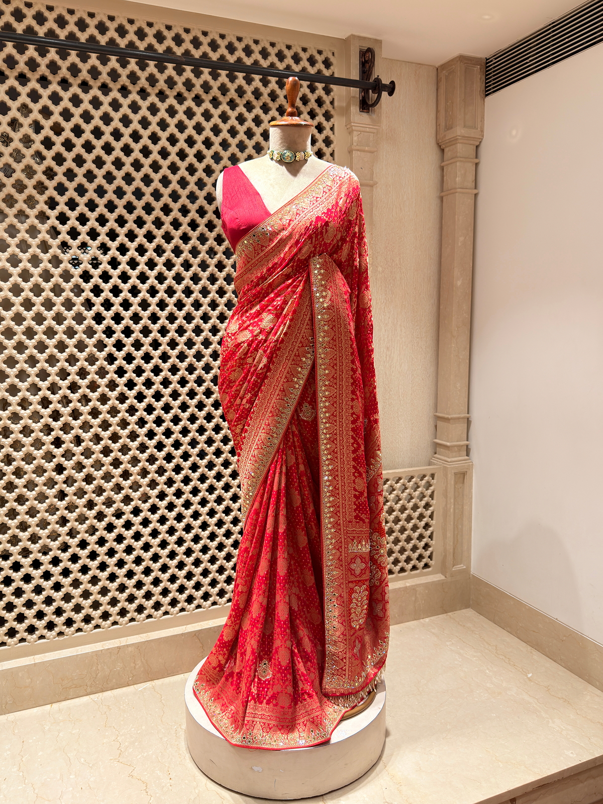 Radiant Red Khaddi Georgette Saree adorned with Mirror Work & Bandhani Weave - Unstitched Blouse