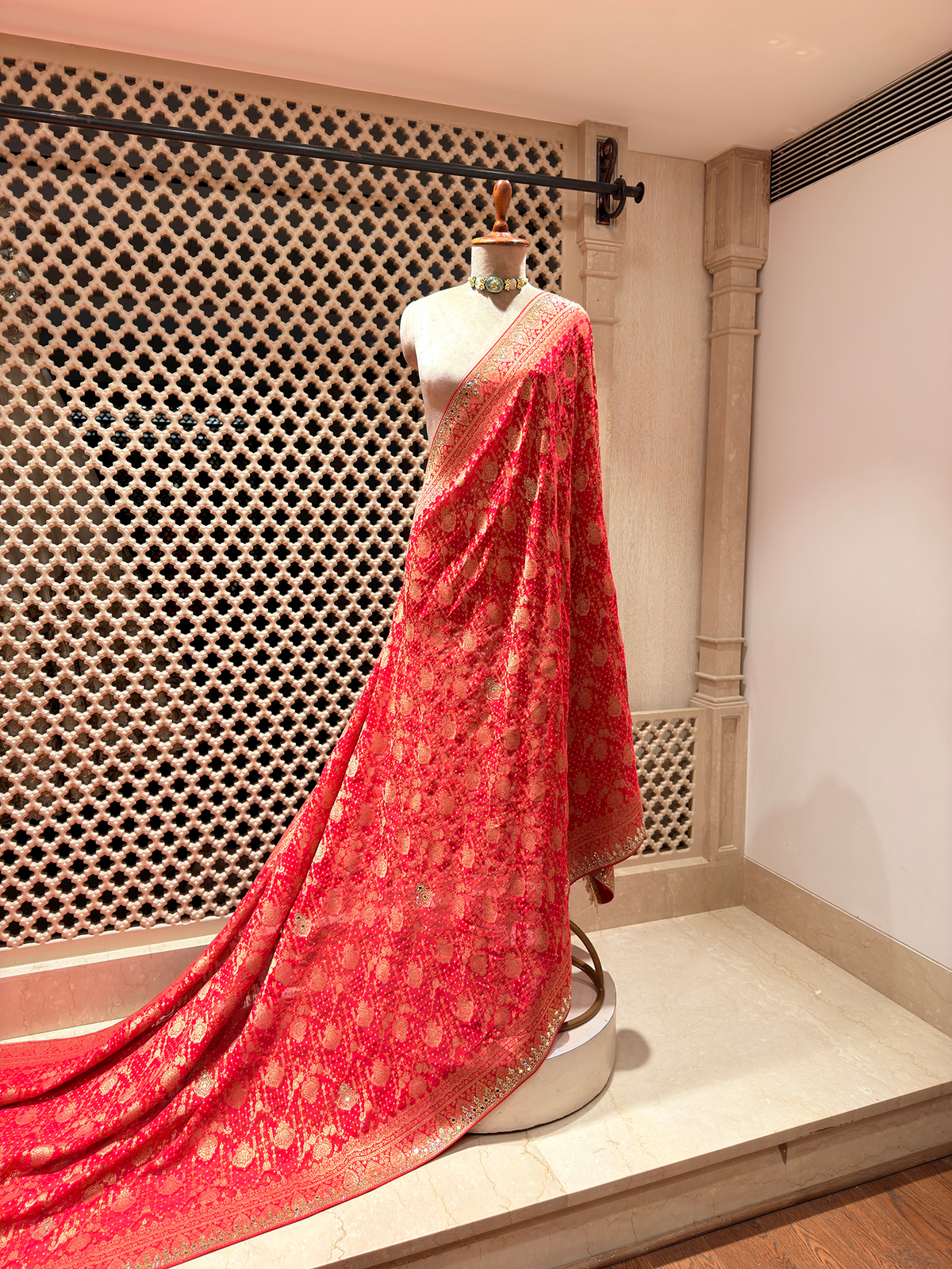 Radiant Red Khaddi Georgette Saree adorned with Mirror Work & Bandhani Weave - Unstitched Blouse
