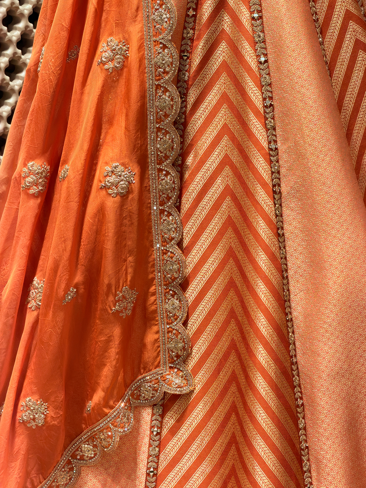 Sunset Orange Brocade Silk Lehenga with Chevron Weave & Mirror Zarkan Work