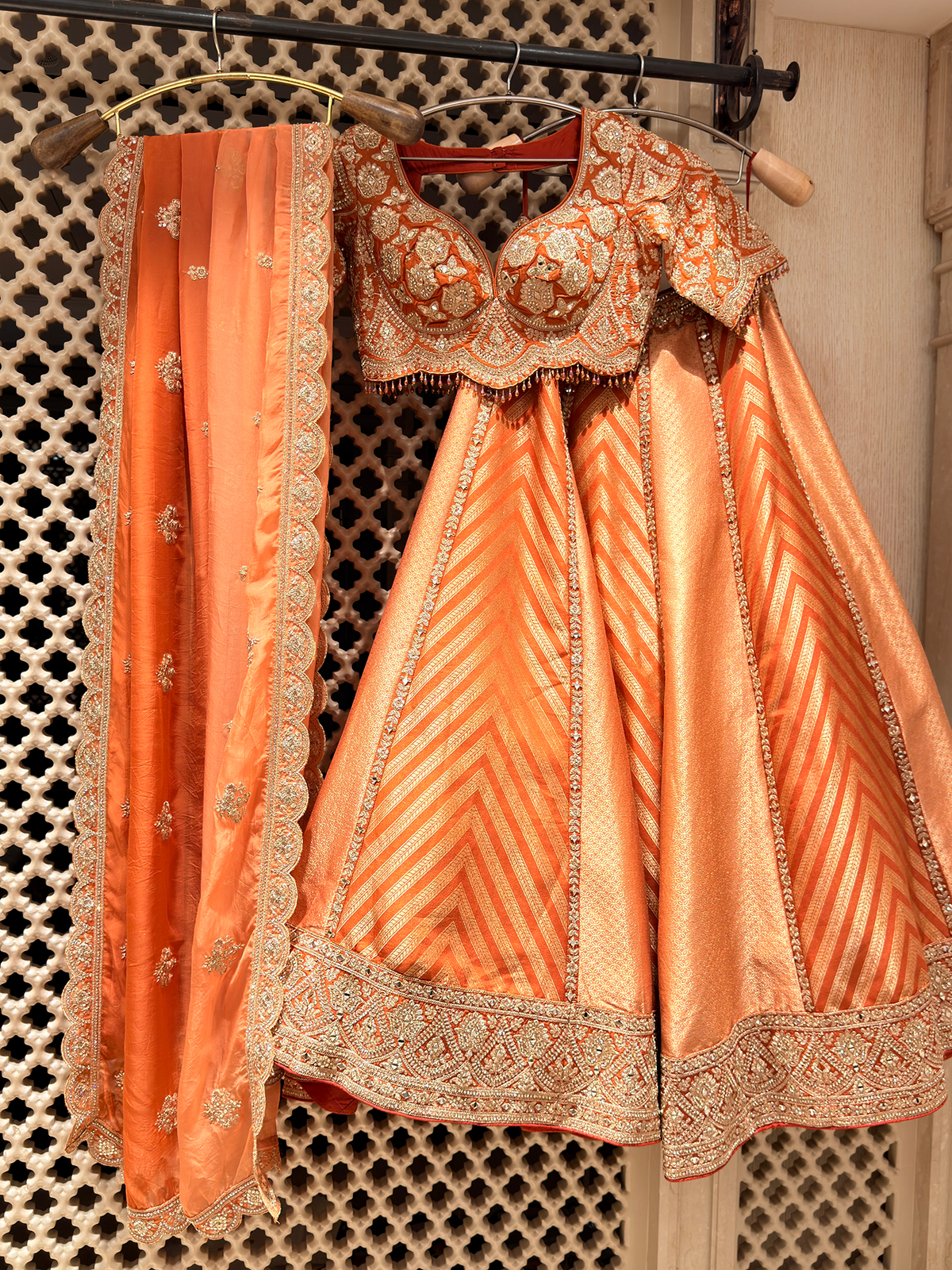 Sunset Orange Brocade Silk Lehenga with Chevron Weave & Mirror Zarkan Work